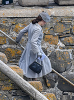 Lily James filming scenes from "Guernsey" at Clovelly Harbour