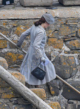 Lily James filming scenes from "Guernsey" at Clovelly Harbour