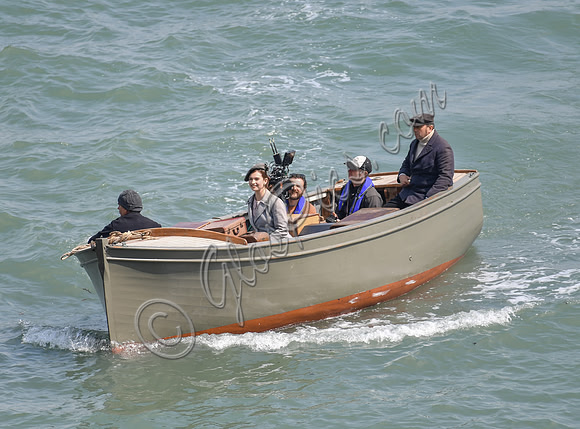 Lily James and Mike Newell filming scenes from "Guernsey" at Clovelly Harbour