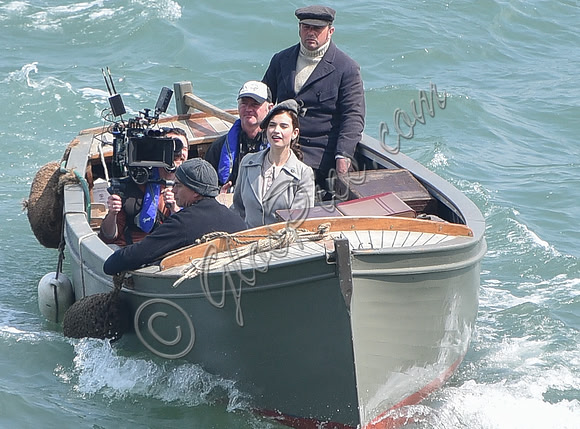 Lily James and Mike Newell filming scenes from "Guernsey" at Clovelly Harbour