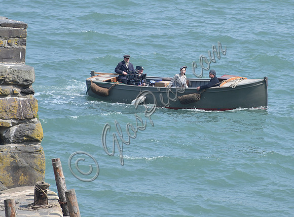 Lily James and Mike Newell filming scenes from "Guernsey" at Clovelly Harbour