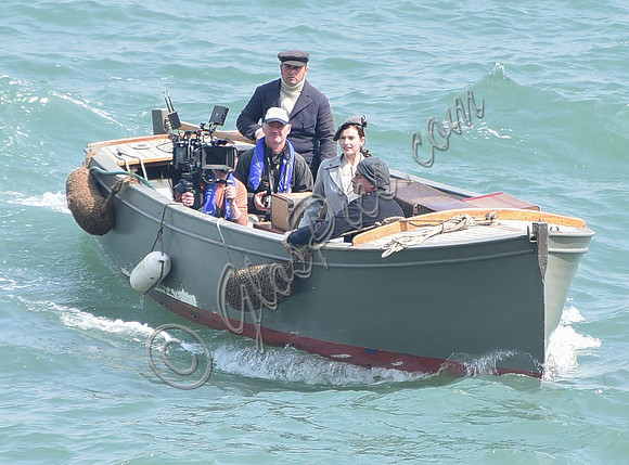 Lily James and Mike Newell filming scenes from "Guernsey" at Clovelly Harbour