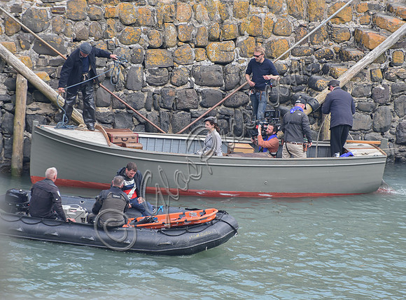 Lily James filming scenes from "Guernsey" at Clovelly Harbour