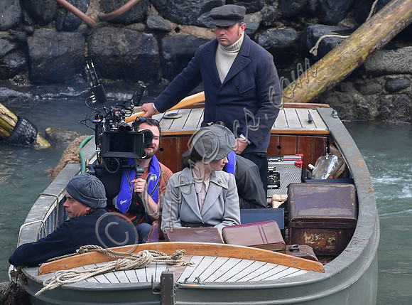 Lily James filming scenes from "Guernsey" at Clovelly Harbour
