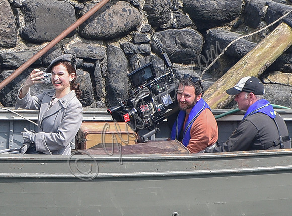 Lily James filming scenes from "Guernsey" at Clovelly Harbour