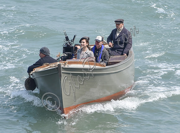 Lily James and Mike Newell filming scenes from "Guernsey" at Clovelly Harbour