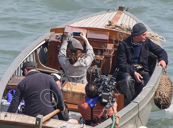 Lily James filming scenes from "Guernsey" at Clovelly Harbour