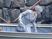 Lily James filming scenes from "Guernsey" at Clovelly Harbour