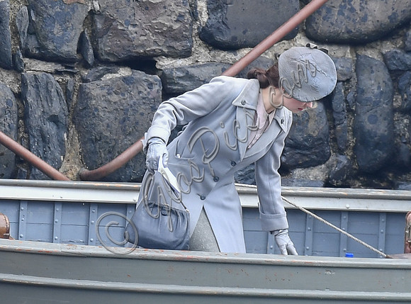 Lily James filming scenes from "Guernsey" at Clovelly Harbour