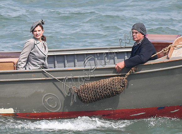 Lily James filming scenes from "Guernsey" at Clovelly Harbour
