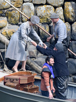 Lily James filming scenes from "Guernsey" at Clovelly Harbour
