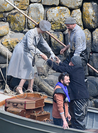 Lily James filming scenes from "Guernsey" at Clovelly Harbour