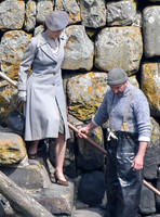 Lily James filming scenes from "Guernsey" at Clovelly Harbour