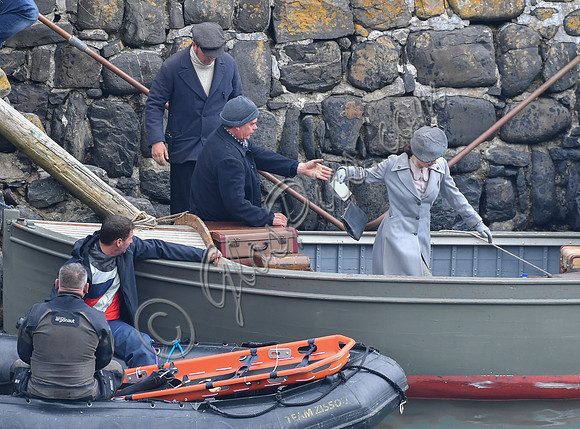 Lily James filming scenes from "Guernsey" at Clovelly Harbour