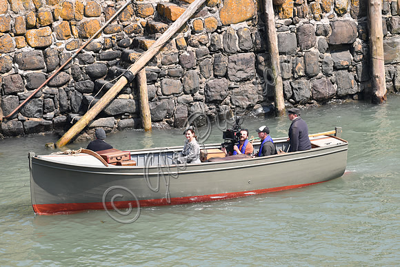 Lily James filming scenes from "Guernsey" at Clovelly Harbour