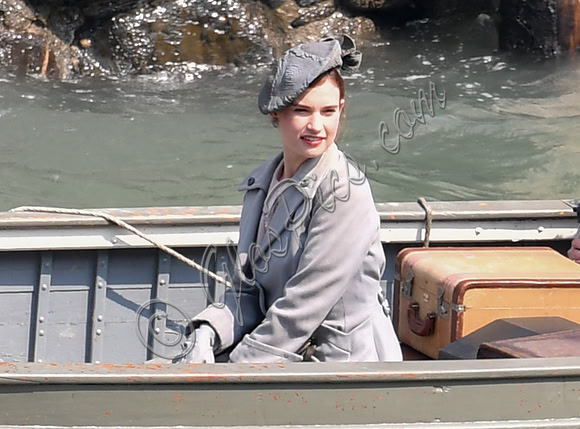 Lily James filming scenes from "Guernsey" at Clovelly Harbour