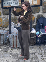 Lily James filming scenes from "Guernsey" at Clovelly Harbour