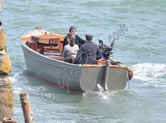 Lily James filming scenes from "Guernsey" at Clovelly Harbour