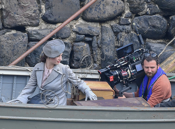 Lily James filming scenes from "Guernsey" at Clovelly Harbour