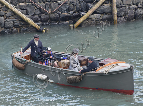 Lily James filming scenes from "Guernsey" at Clovelly Harbour