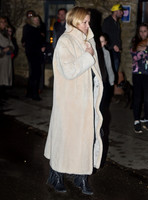 Kate Moss wearing calf length faux fur cream coat