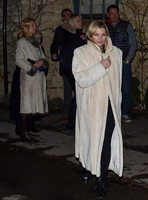 Kate Moss wearing calf length faux fur cream coat