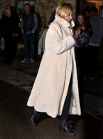 Kate Moss wearing calf length faux fur cream coat