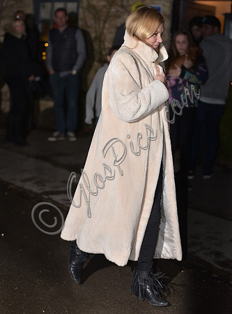 Kate Moss wearing calf length faux fur cream coat