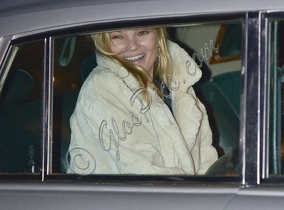 Kate Moss wearing calf length faux fur cream coat (car shot)
