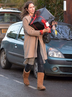 Rosemary Chapman carrying Christmas gifts