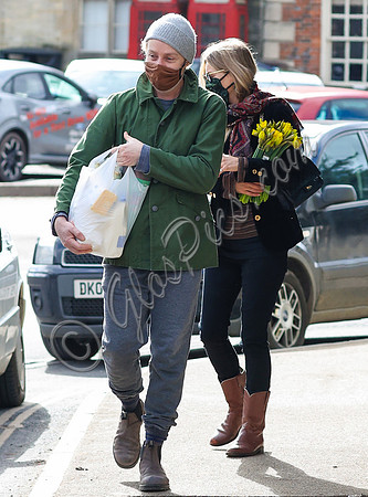 Kate Moss carrying daffodils with James Brown