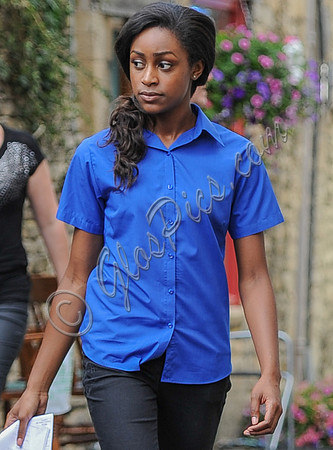 Simona Brown wearing blue short sleeved shirt