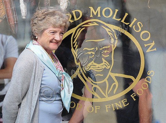 Julia McKenzie outside of Mollison's Deli, smiling
