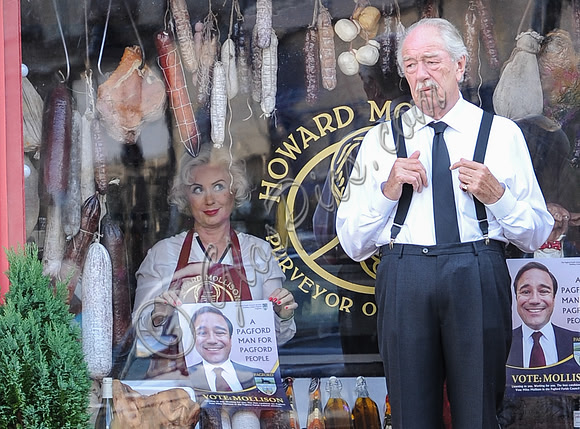 Sir Michael Gambon outside the deli with Hetty Banes looking out from window