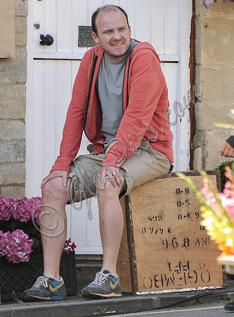 Rory Kinnear sat on tea chest