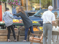 Mary Fairbrother (Emily Bevan) and Terri Weedon (Keeley Forsyth) fighting in market place.