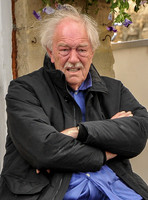 Sir Michael Gambon as Howard Mollison wearing blue pyjamas  (close up)