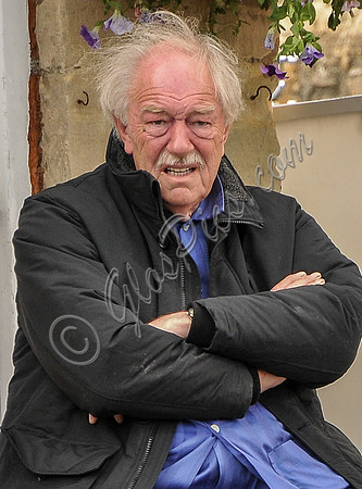 Sir Michael Gambon as Howard Mollison wearing blue pyjamas  (close up)