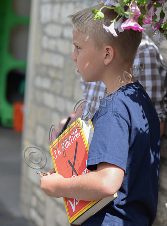 small boy with Casual Vacancy book under his arm