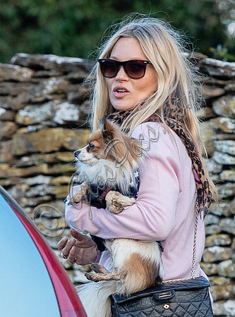 Kate Moss with dog "Stanley" under arm