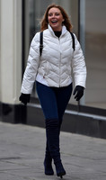 Carol Vorderman in skin tight jeans and a figure hugging black sweater
