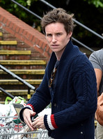 Eddie Redmayne wearing blue cardigan, skinny jeans and trainers on shopping trip to Stroud