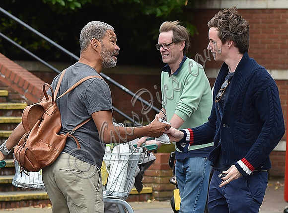 Eddie Redmayne wearing blue cardigan, skinny jeans and trainers on shopping trip to Stroud
