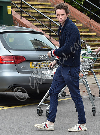 Eddie Redmayne wearing blue cardigan, skinny jeans and trainers on shopping trip to Stroud