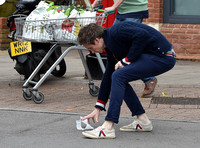 Eddie Redmayne wearing blue cardigan, skinny jeans and trainers on shopping trip to Stroud