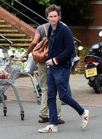 Eddie Redmayne wearing blue cardigan, skinny jeans and trainers on shopping trip to Stroud