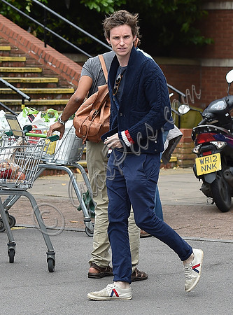 Eddie Redmayne wearing blue cardigan, skinny jeans and trainers on shopping trip to Stroud