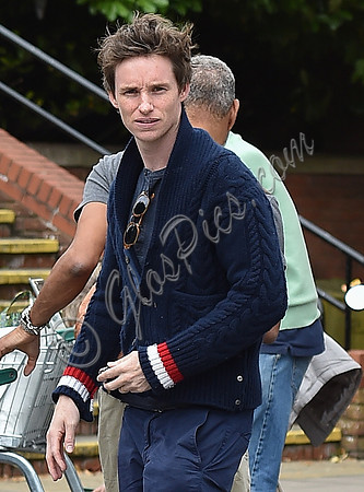 Eddie Redmayne wearing blue cardigan, skinny jeans and trainers on shopping trip to Stroud