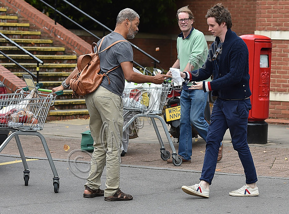 Eddie Redmayne wearing blue cardigan, skinny jeans and trainers on shopping trip to Stroud