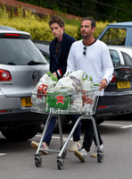 Eddie Redmayne wearing blue cardigan, skinny jeans and trainers on shopping trip to Stroud